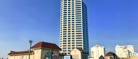 A tall building with the sign "Atlantic Palace" at the top.