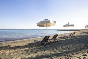 On the beach, sun loungers, beach umbrellas, snorkeling - Harmony Bay Hotel (Limassol)
