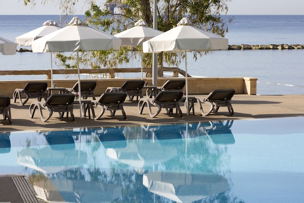 Seasonal outdoor pool, pool umbrellas, pool loungers