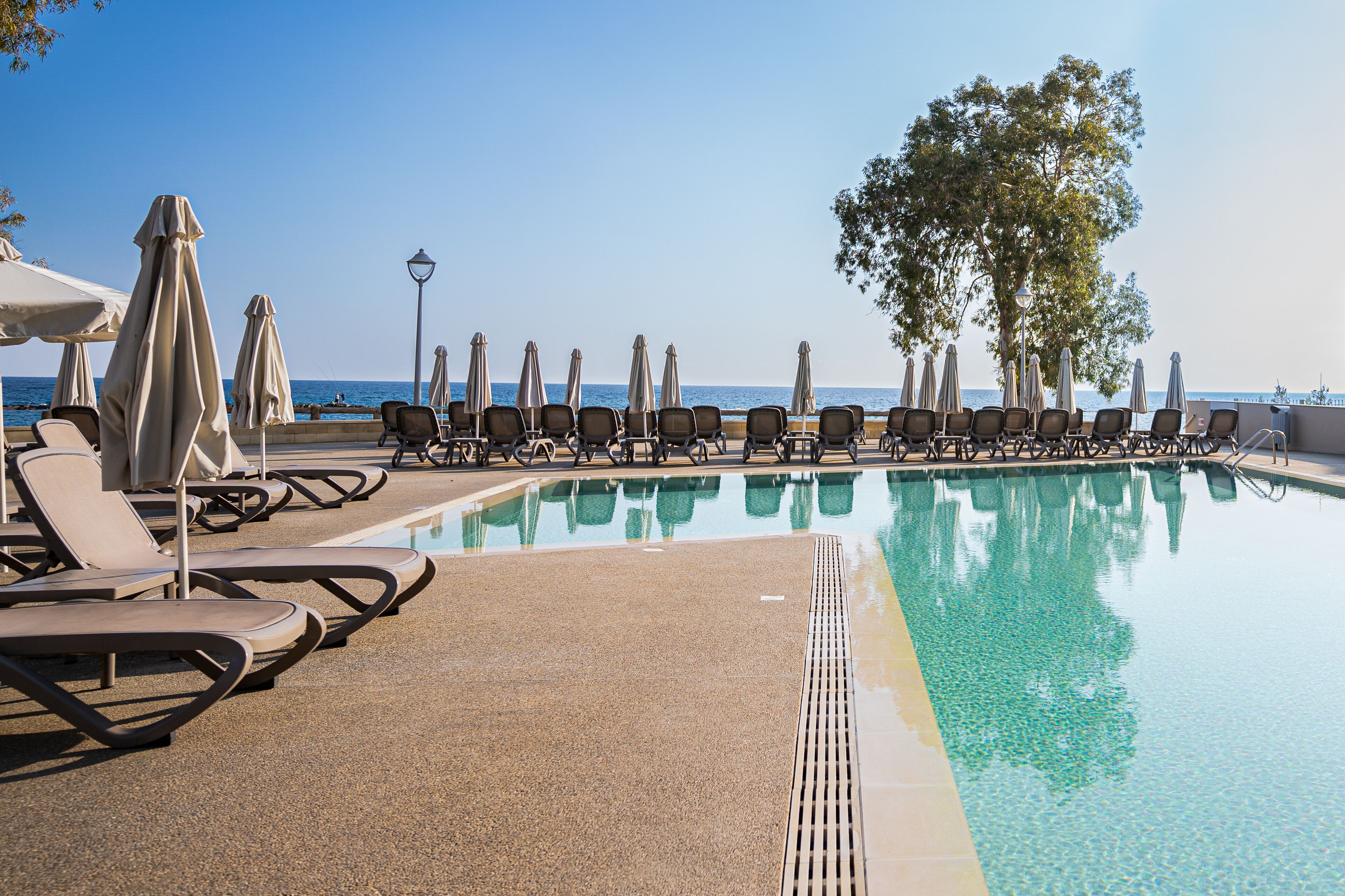 seasonal outdoor pool, pool umbrellas, pool loungers