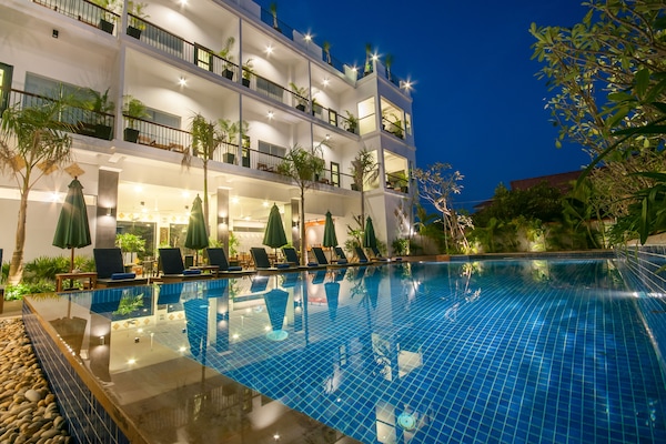 Outdoor pool, open 7:00 AM to 7:00 PM, pool umbrellas, sun loungers
