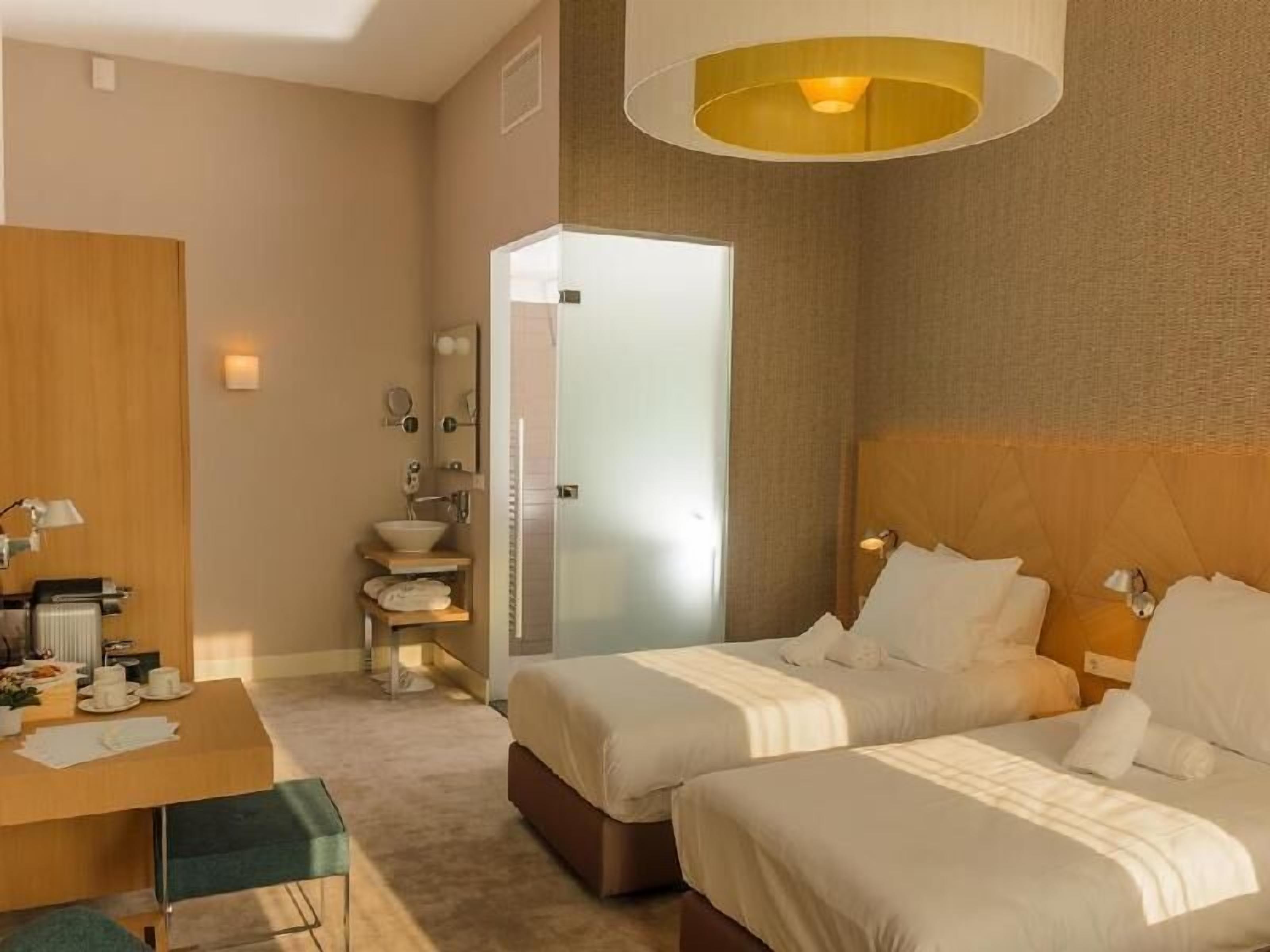 Hypo-allergenic bedding, free minibar, in-room safe, desk