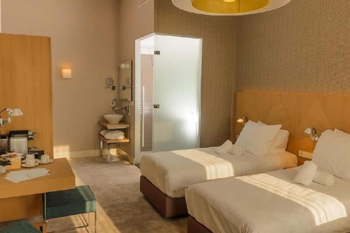 Hypo-allergenic bedding, free minibar, in-room safe, desk