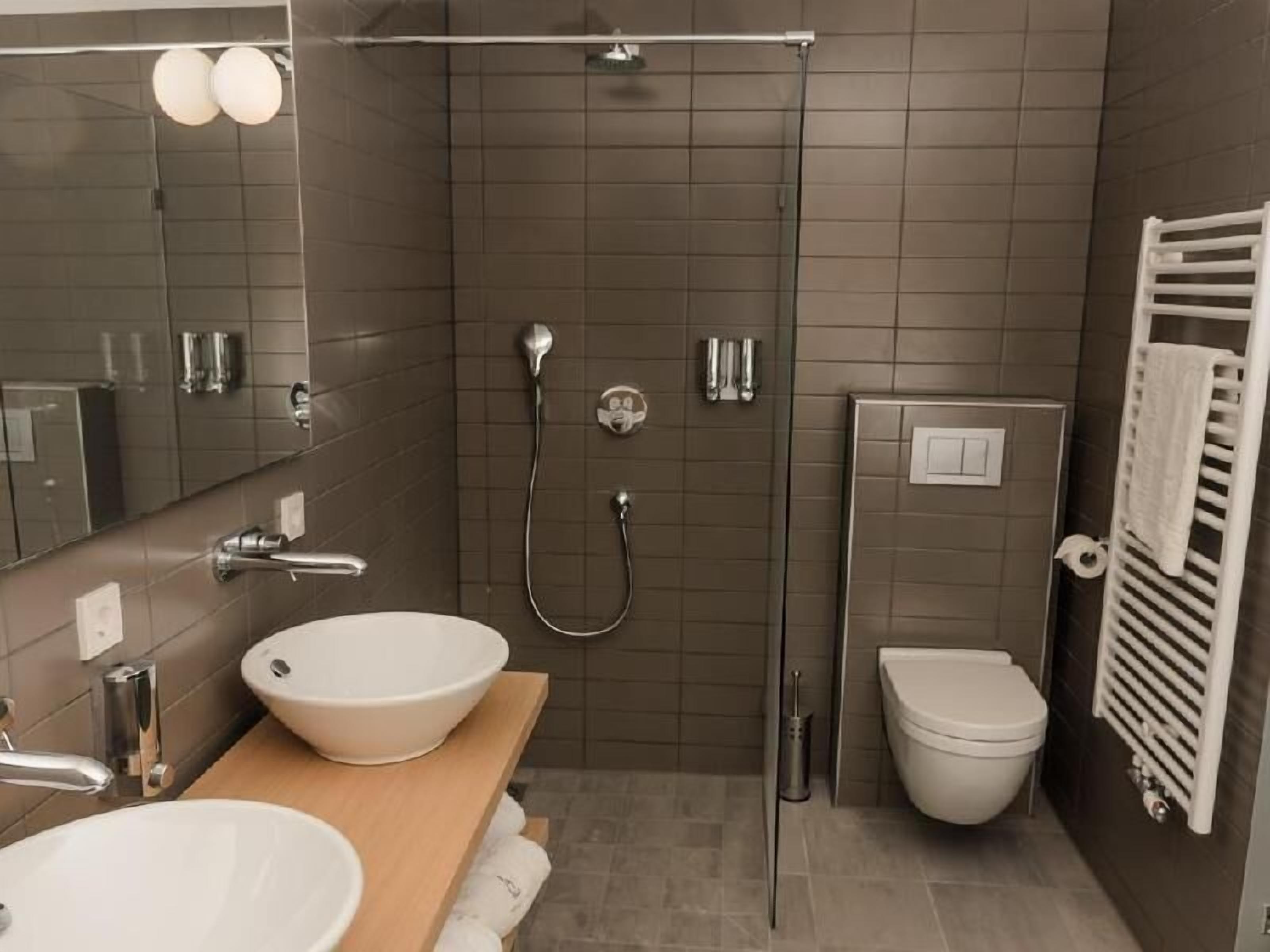 Bathroom | Shower, free toiletries, hair dryer, bathrobes