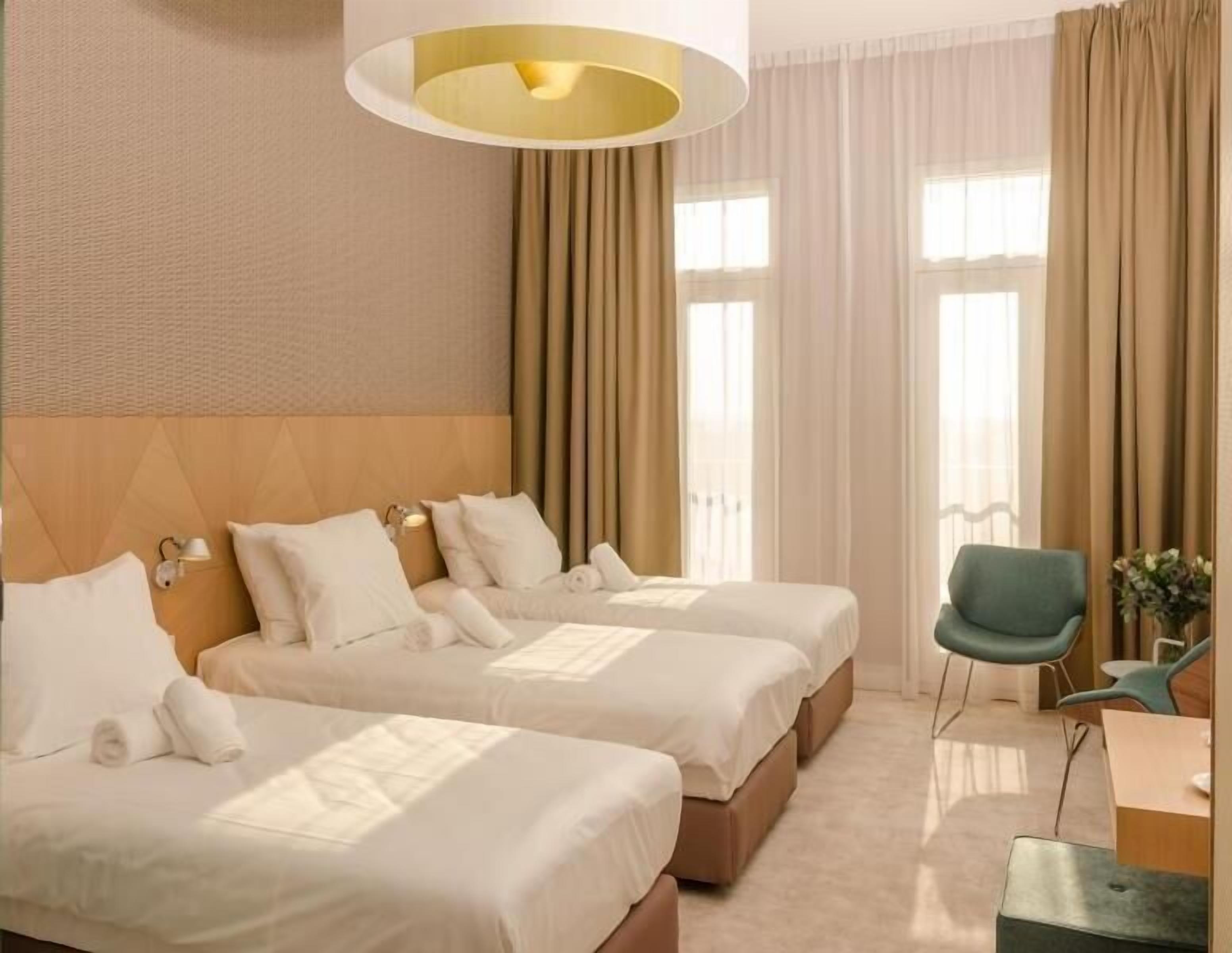 Hypo-allergenic bedding, free minibar, in-room safe, desk