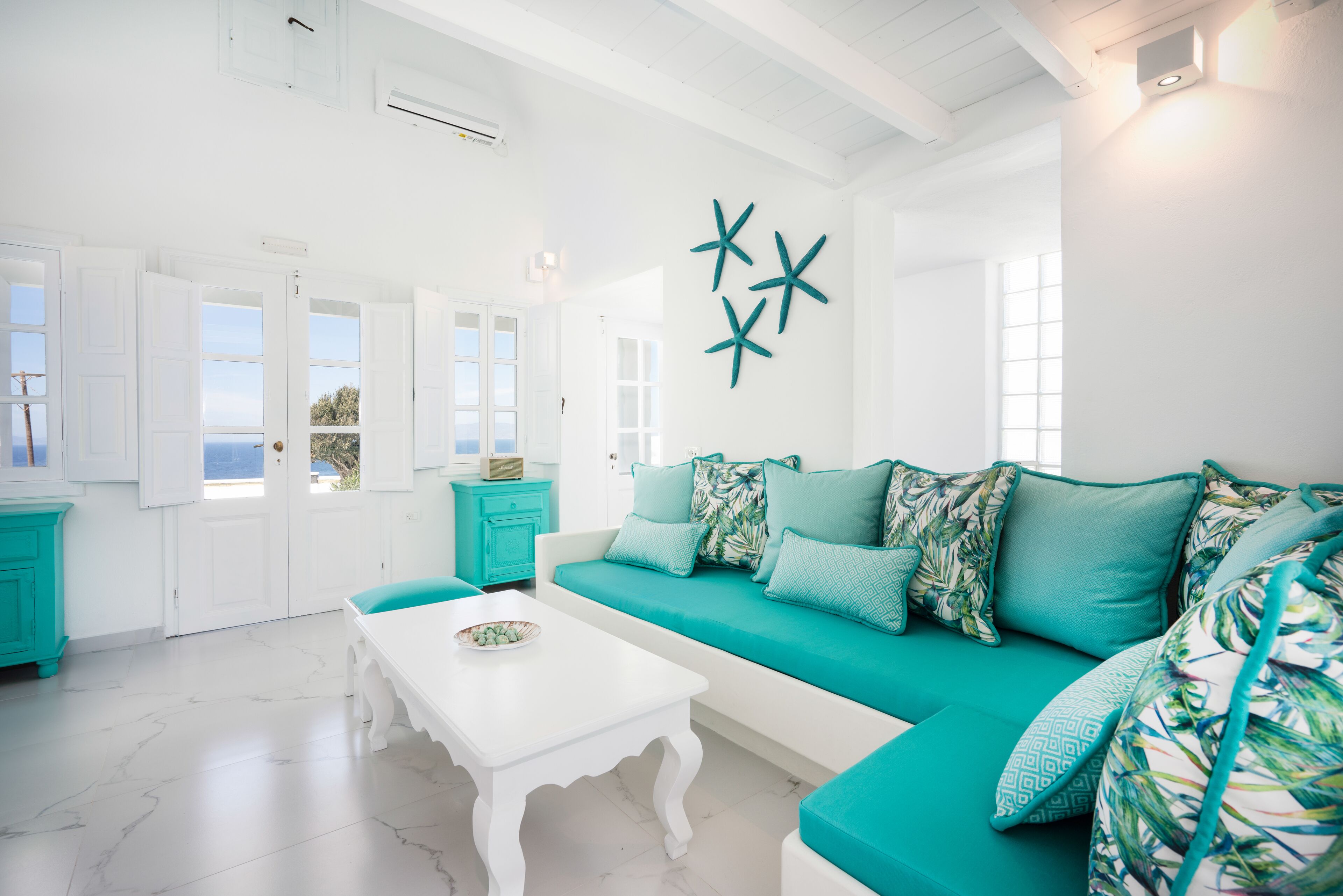 emerald: 3 bedroom villa sunset & sea view with private pool & hot tub | living area | books