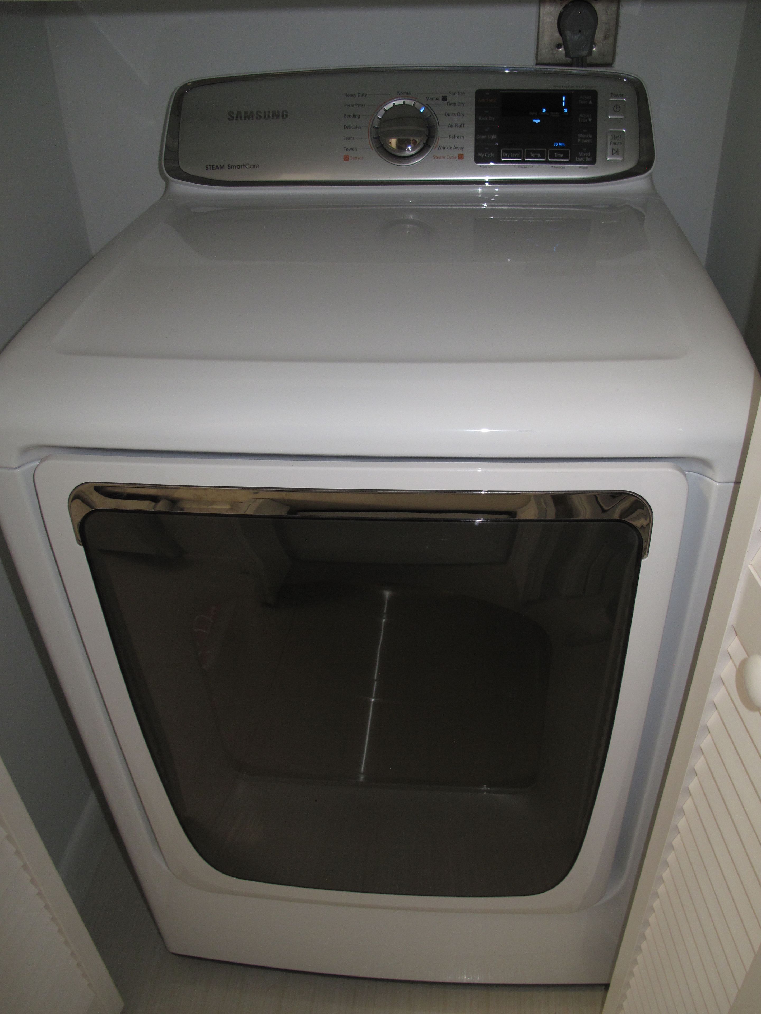 A front view of a Samsung steam smart core washing machine.