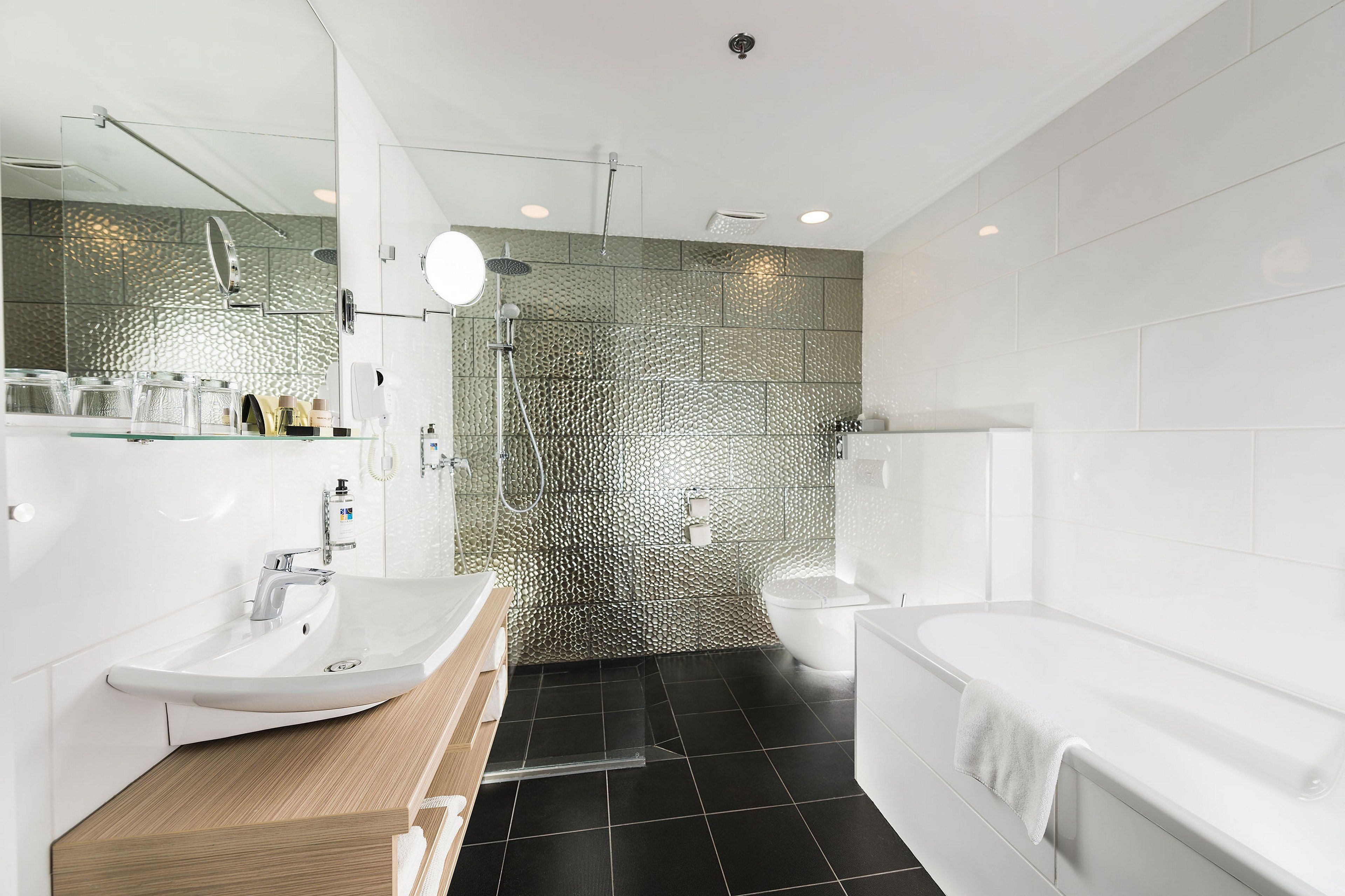 luxury suite with sauna | bathroom | eco-friendly toiletries, hair dryer, towels