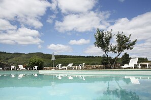 Seasonal outdoor pool, pool loungers