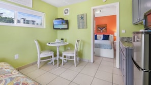 Basic Suite, 1 Bedroom, Kitchenette | Living area | 32-inch flat-screen TV with digital channels, TV, streaming services - Beach House Hotel (Treasure Island)