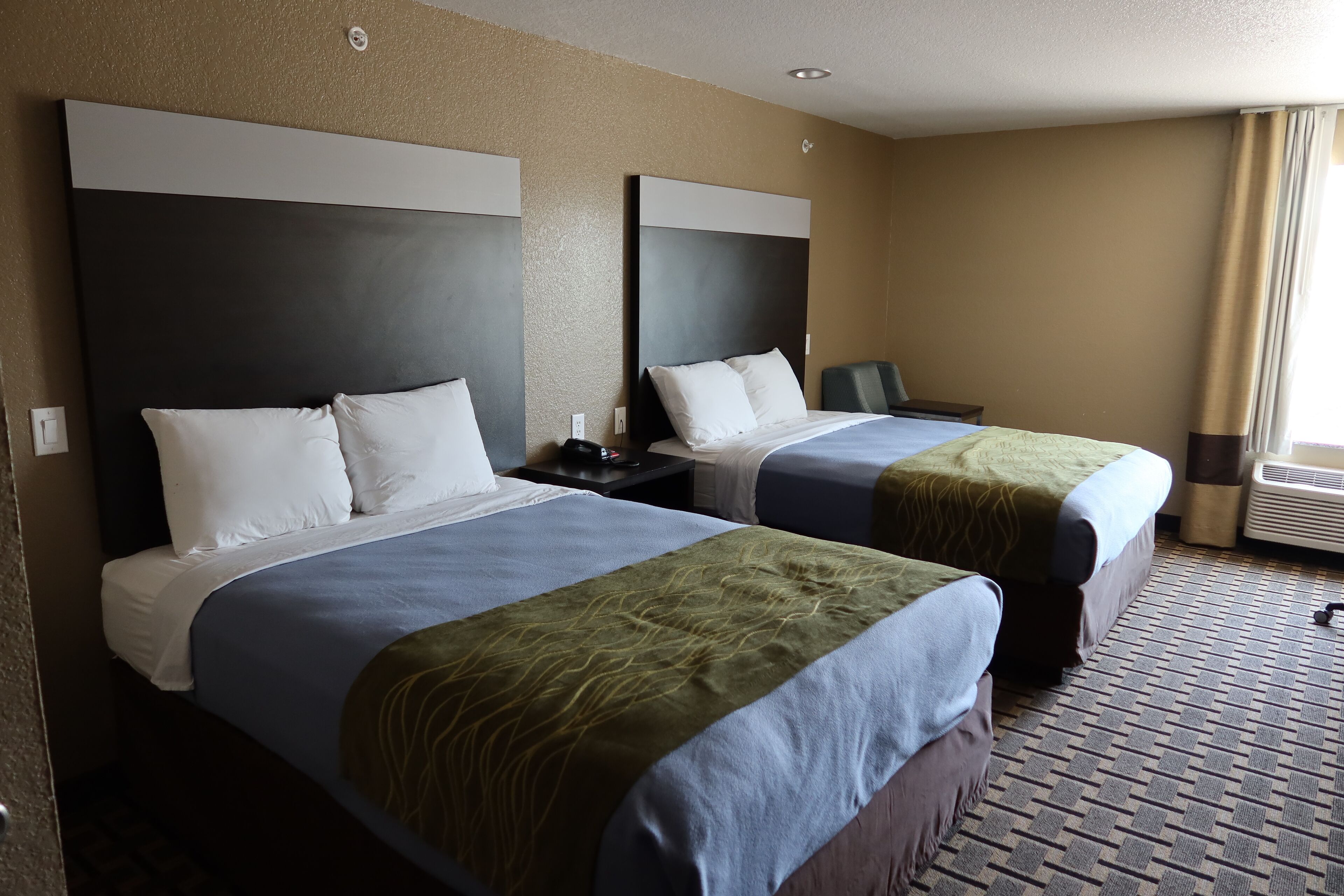 Premium bedding, desk, laptop workspace, soundproofing