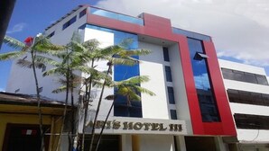 A modern hotel building with a sign reading "HOTEL III". - Ari's Hotel III (Iquitos)