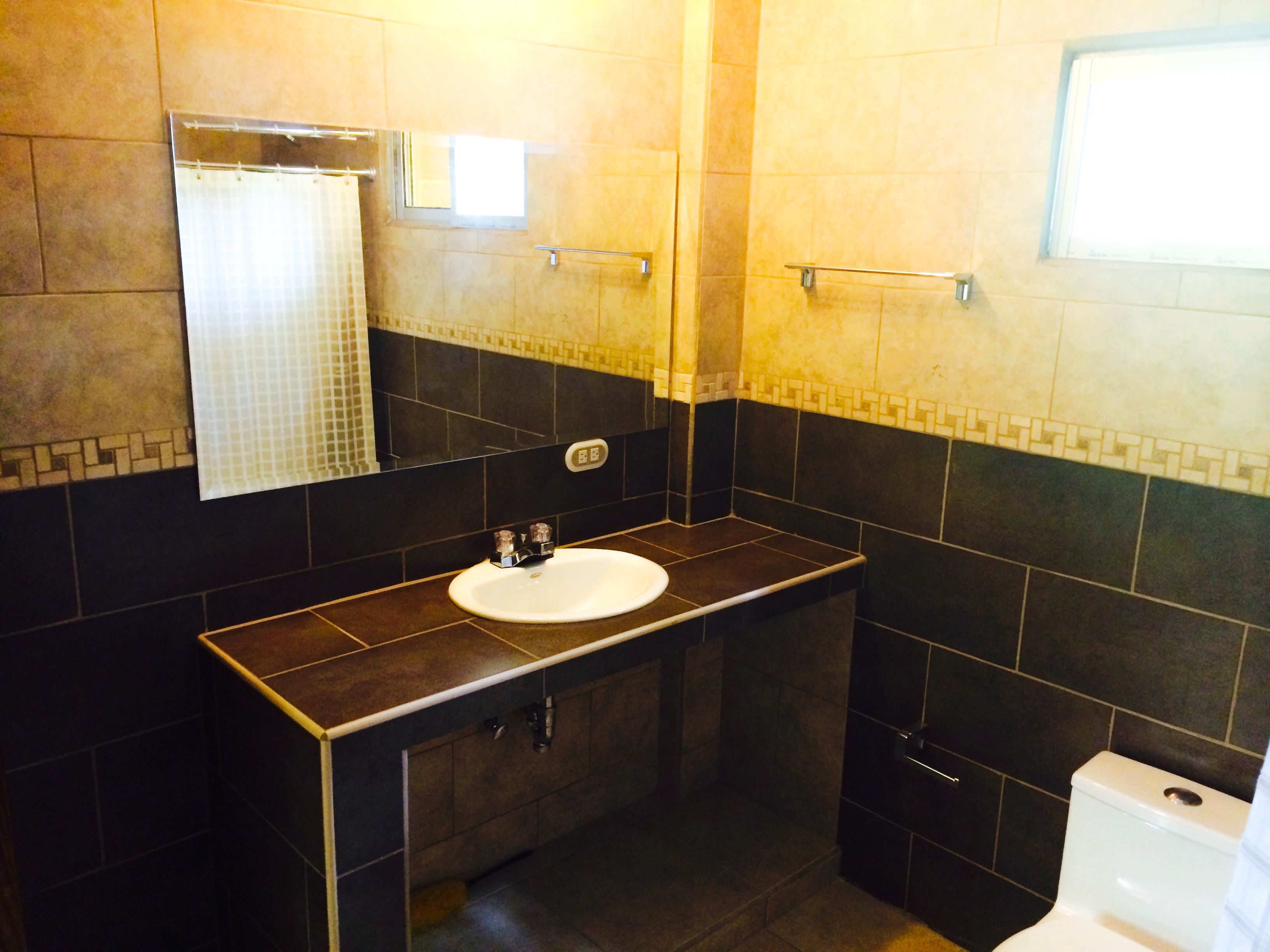 standard apartment, pool view | bathroom | combined shower/bathtub, deep-soaking bathtub, hydromassage showerhead