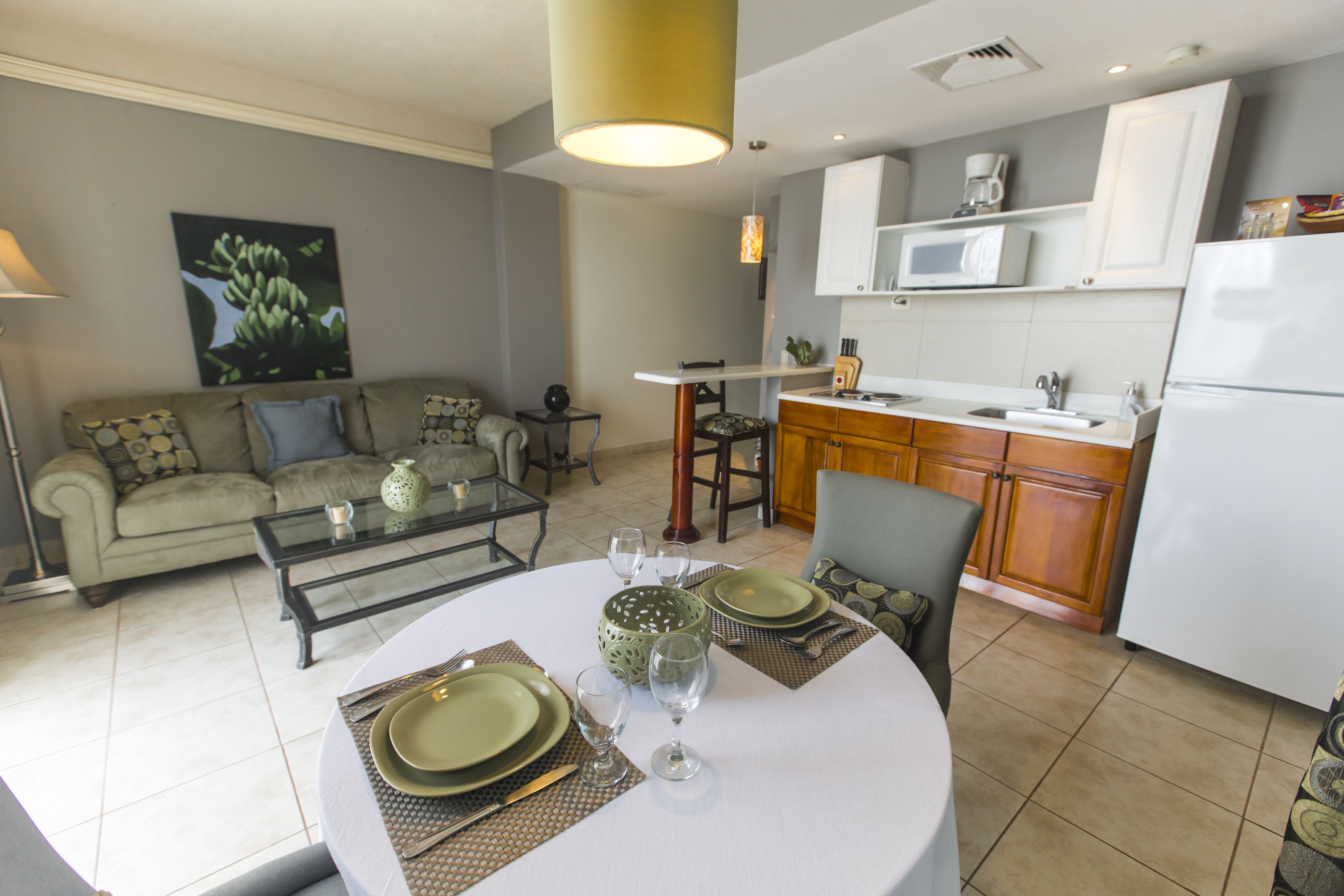 executive apartment, 1 king bed, pool view | in-room dining