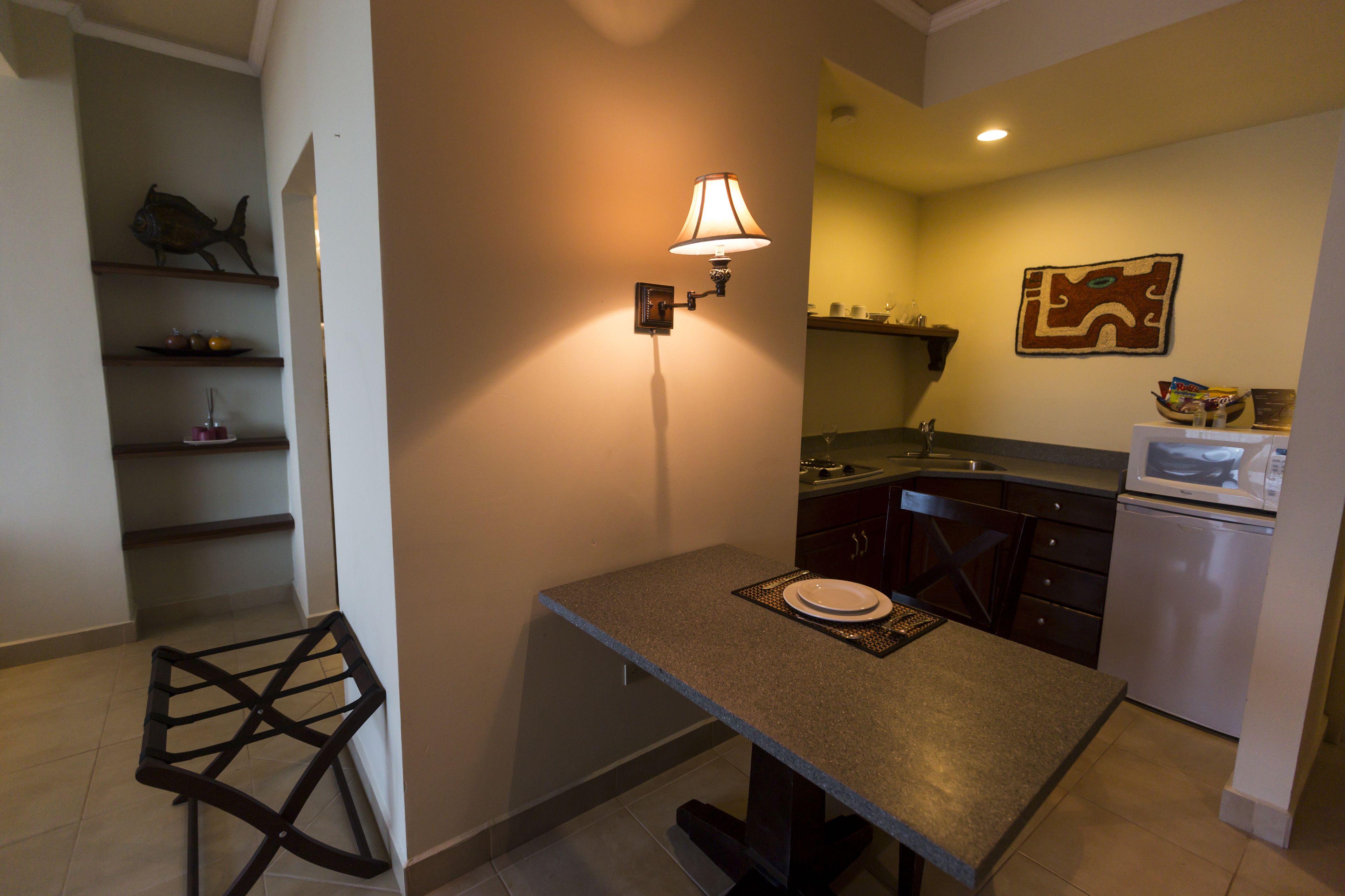 junior studio suite, 1 queen bed | private kitchen | fridge, microwave, stovetop, cookware/dishes/utensils