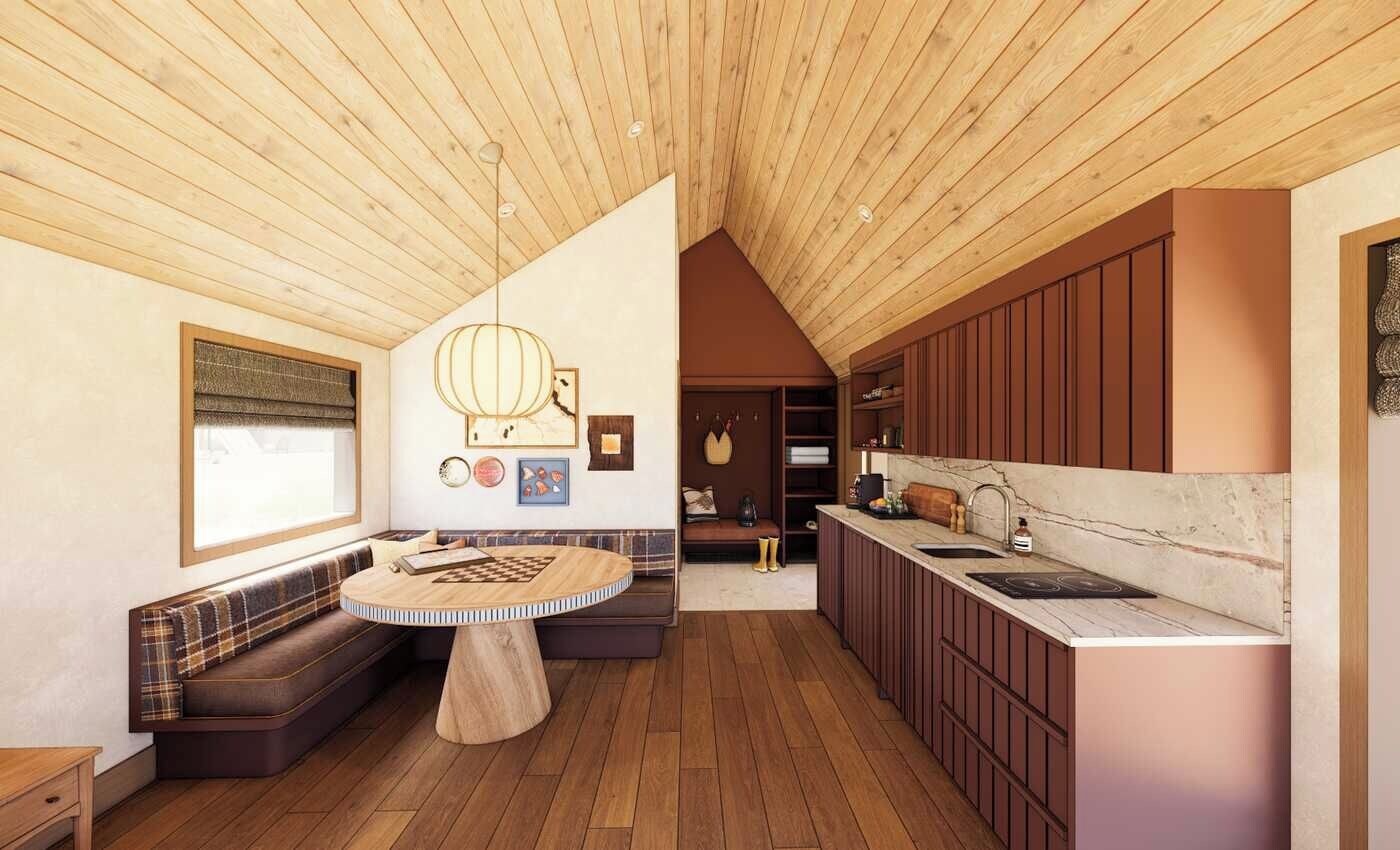 Une cuisine moderne avec des meubles en bois, une table de salle à manger ronde et un banc intégré.