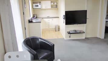 Apartamento conforto, 2 quartos | Cozinha privada | Geladeira, micro-ondas, cooktop, chaleira elétrica