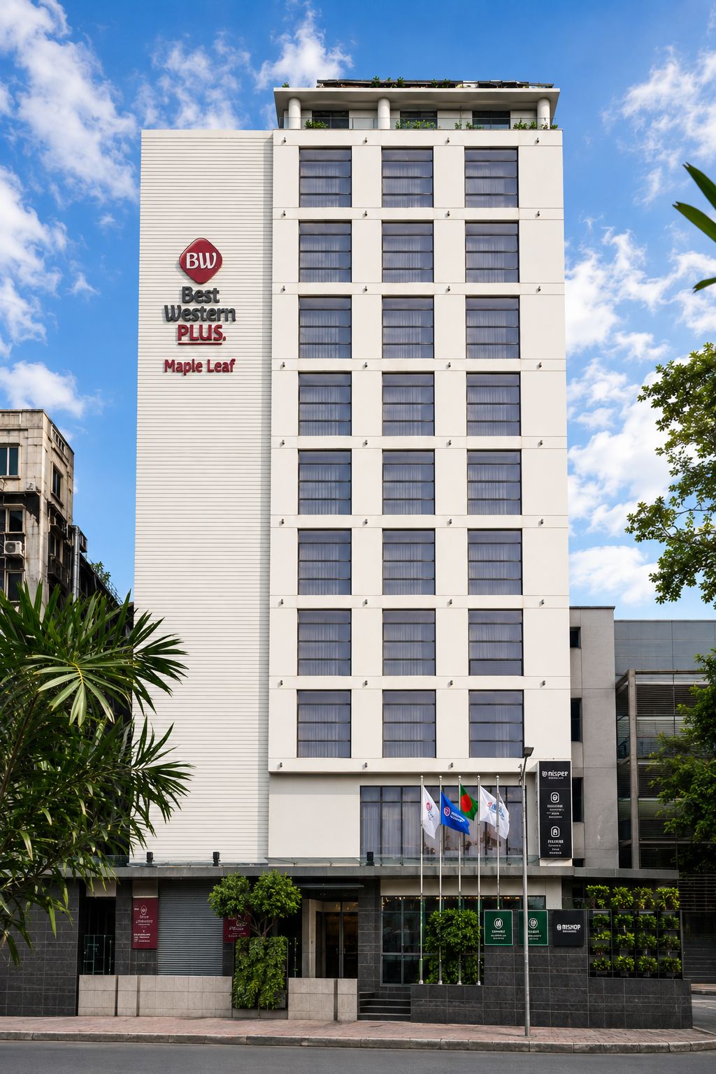 A tall hotel building with a prominent 'Best Western PLUS Maple Leaf' sign.