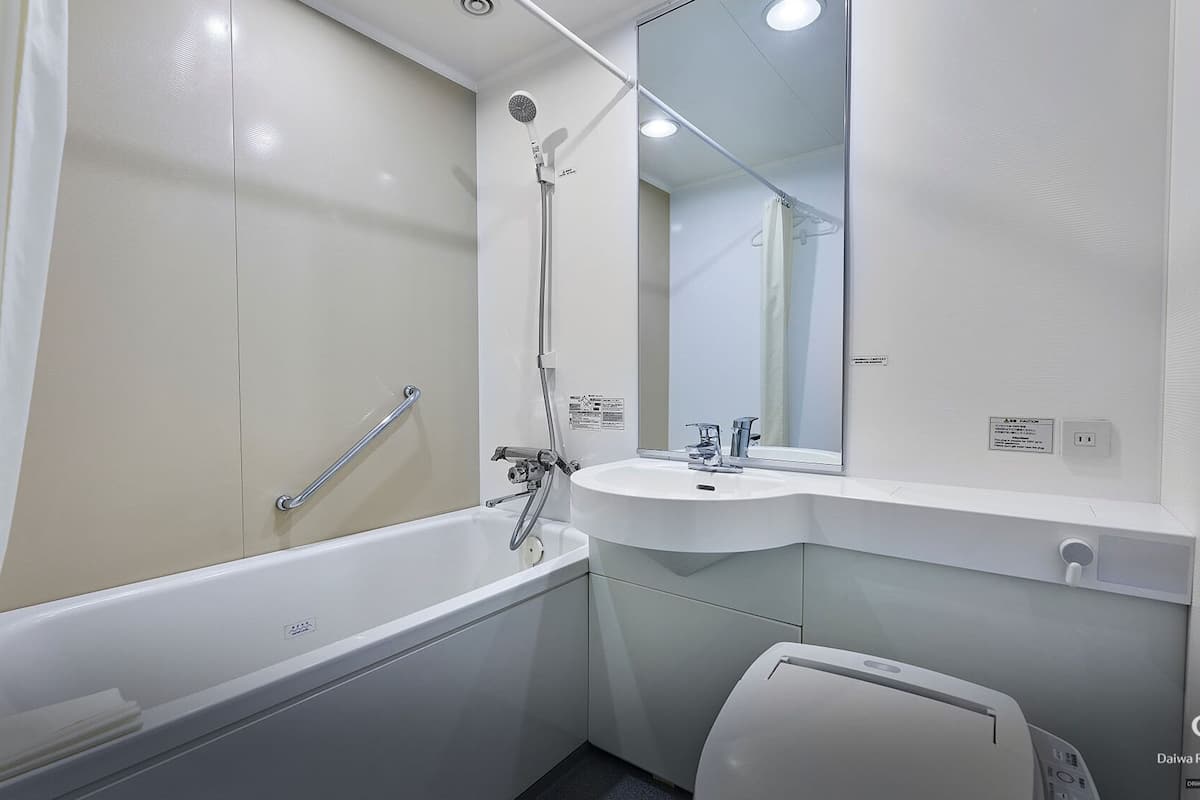 shower, hair dryer, slippers, bidet