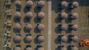 An aerial view of a beach with rows of umbrellas and sun loungers. - Rouge Hotel International (Cervia)