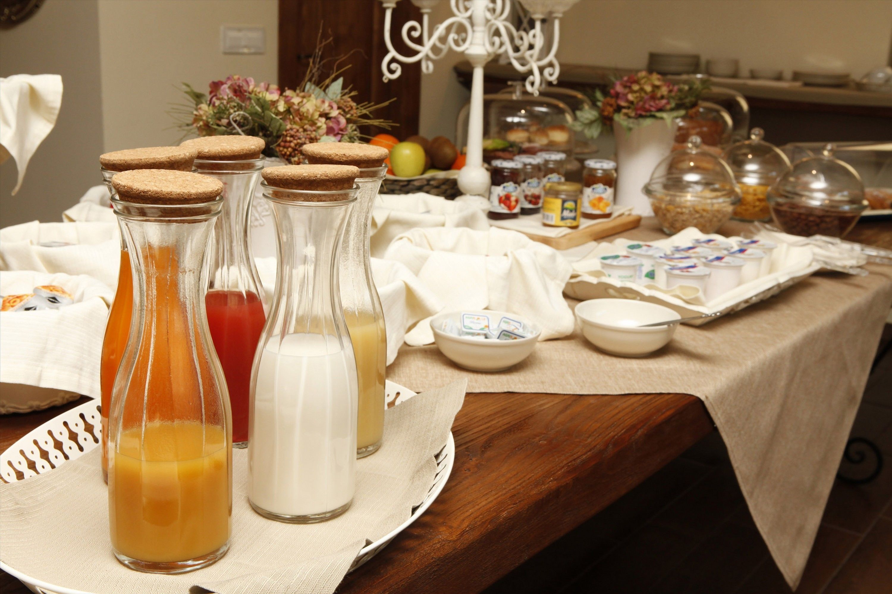 A breakfast buffet with various food items and beverages.