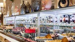 A buffet with various food items and desserts displayed on glass shelves. - Karmir Resort & Spa - Ultra All Inclusive (Kemer)