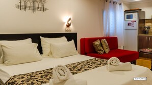 Family Studio | Iron/ironing board (on request), cribs (free), rollaway beds (surcharge)