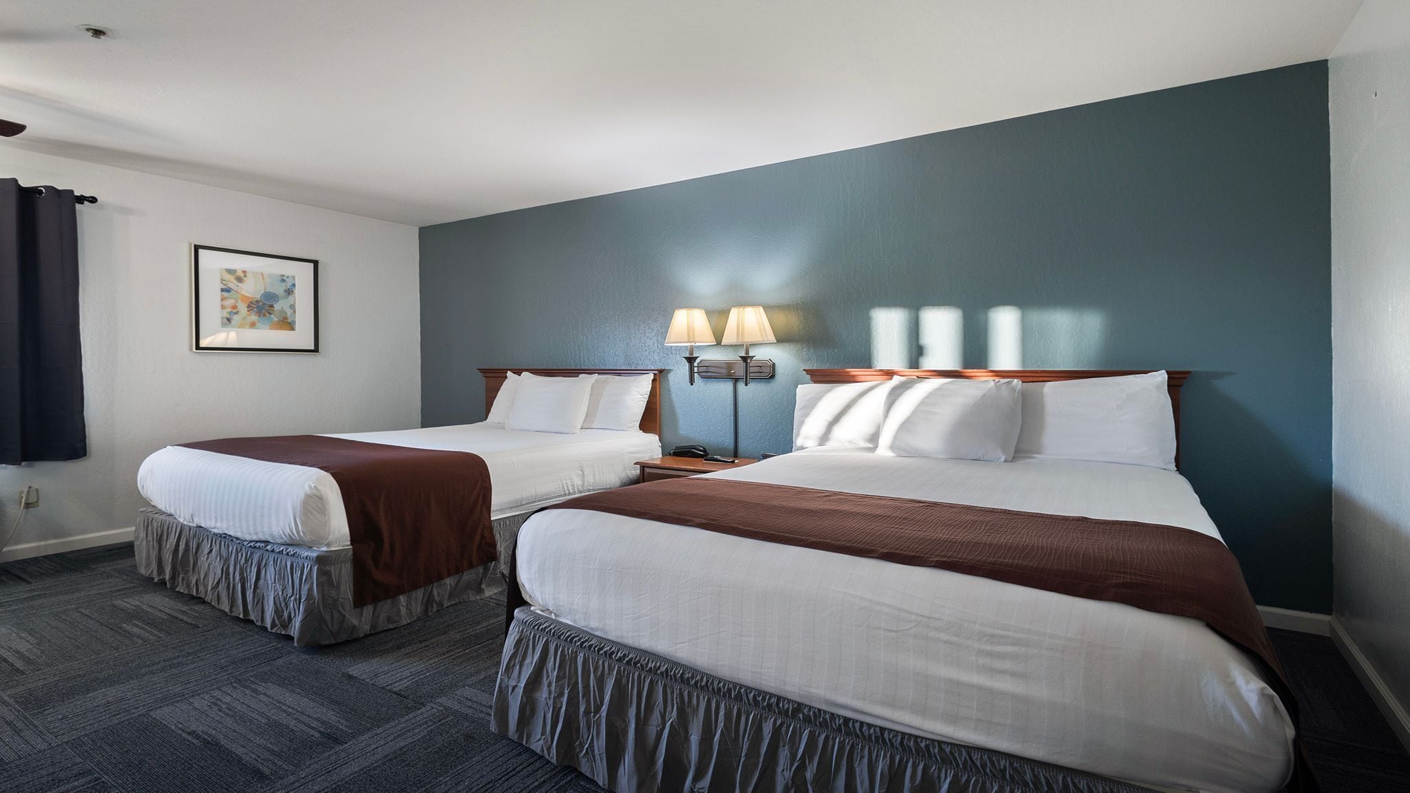 deluxe studio suite, 2 queen beds, non smoking | 1 bedroom, desk, iron/ironing board, free wifi