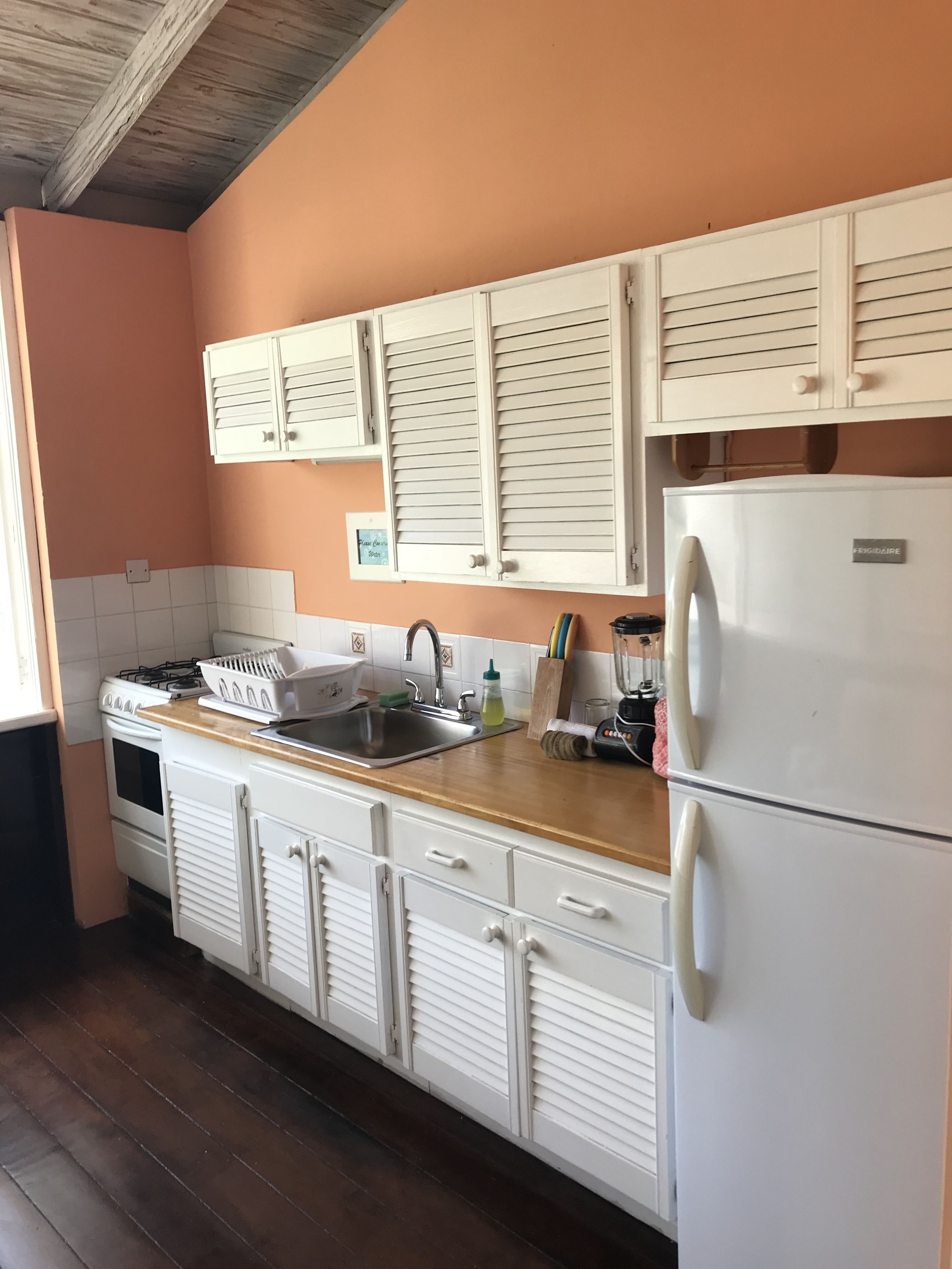 full-sized fridge, microwave, stovetop, coffee/tea maker