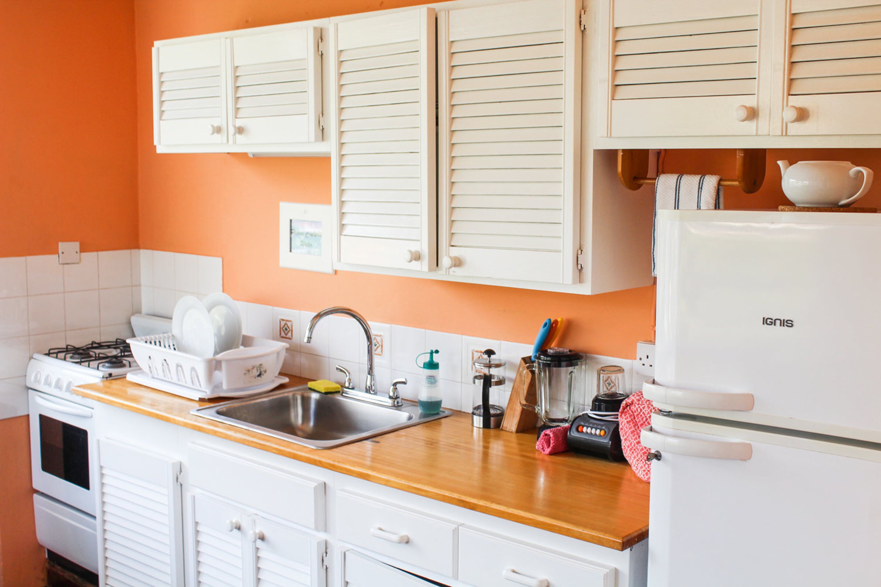 full-sized fridge, microwave, stovetop, coffee/tea maker