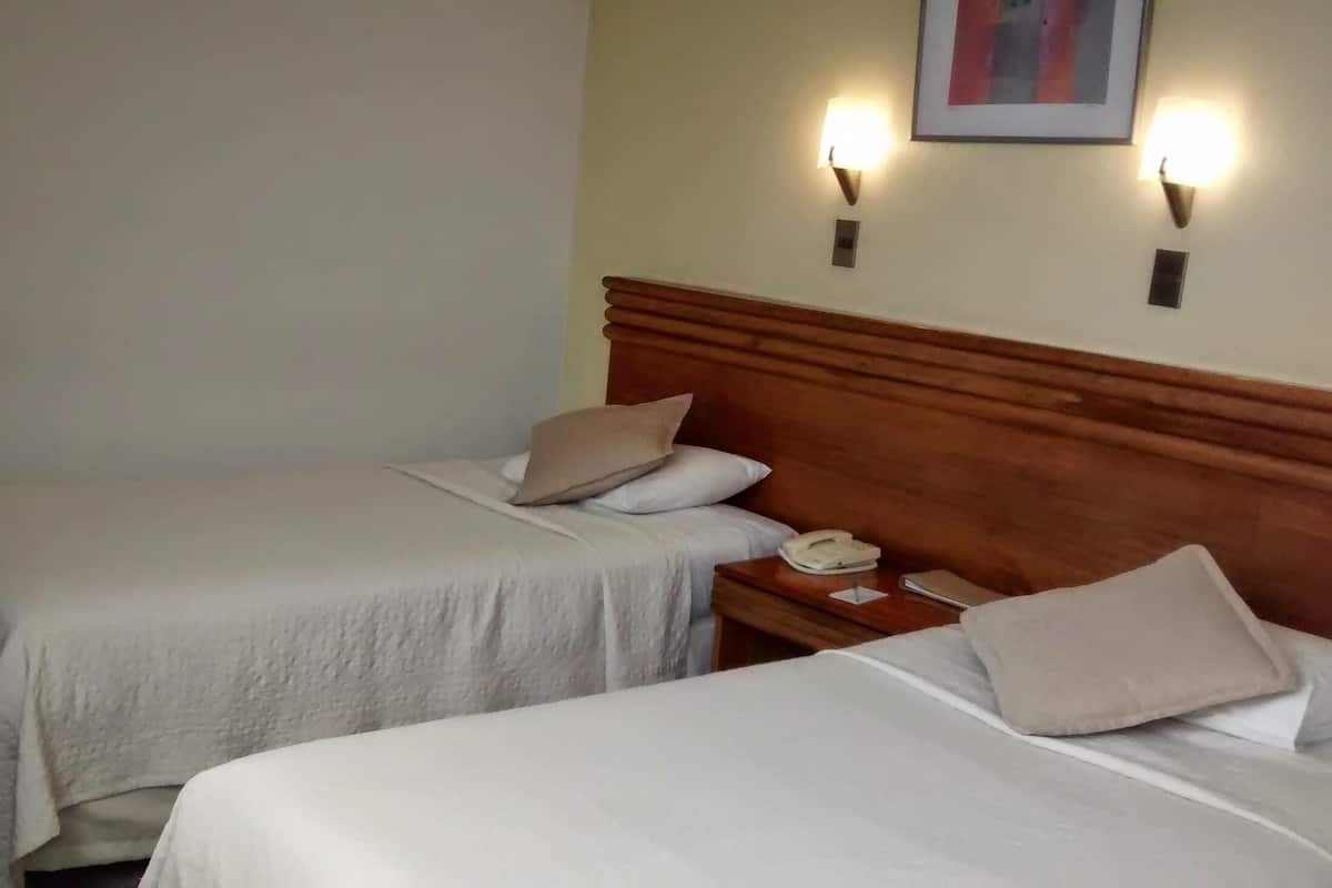2 habitaciones, ropa de cama de alta calidad y minibar