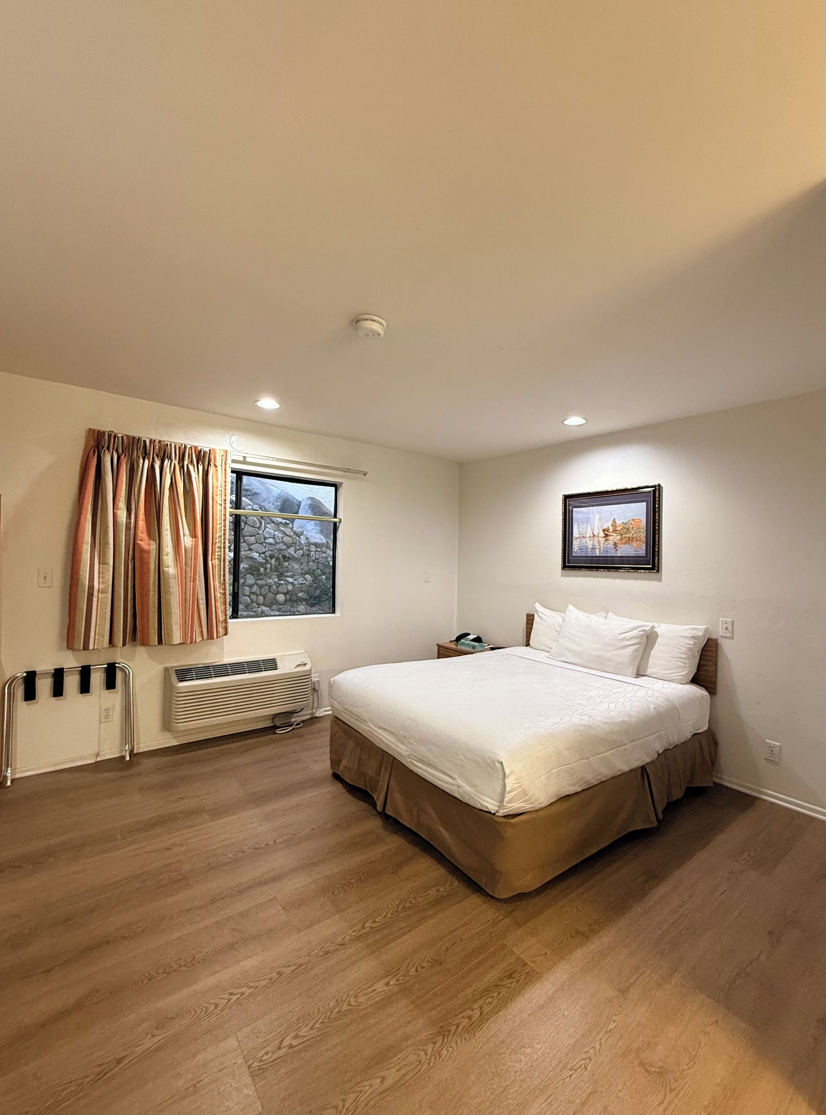 Standard One Queen | Hypo-allergenic bedding, desk, blackout curtains, iron/ironing board
