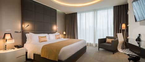 Premium bedding, down comforters, pillowtop beds, minibar