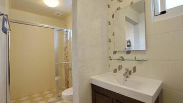 Shower, hair dryer, slippers, towels