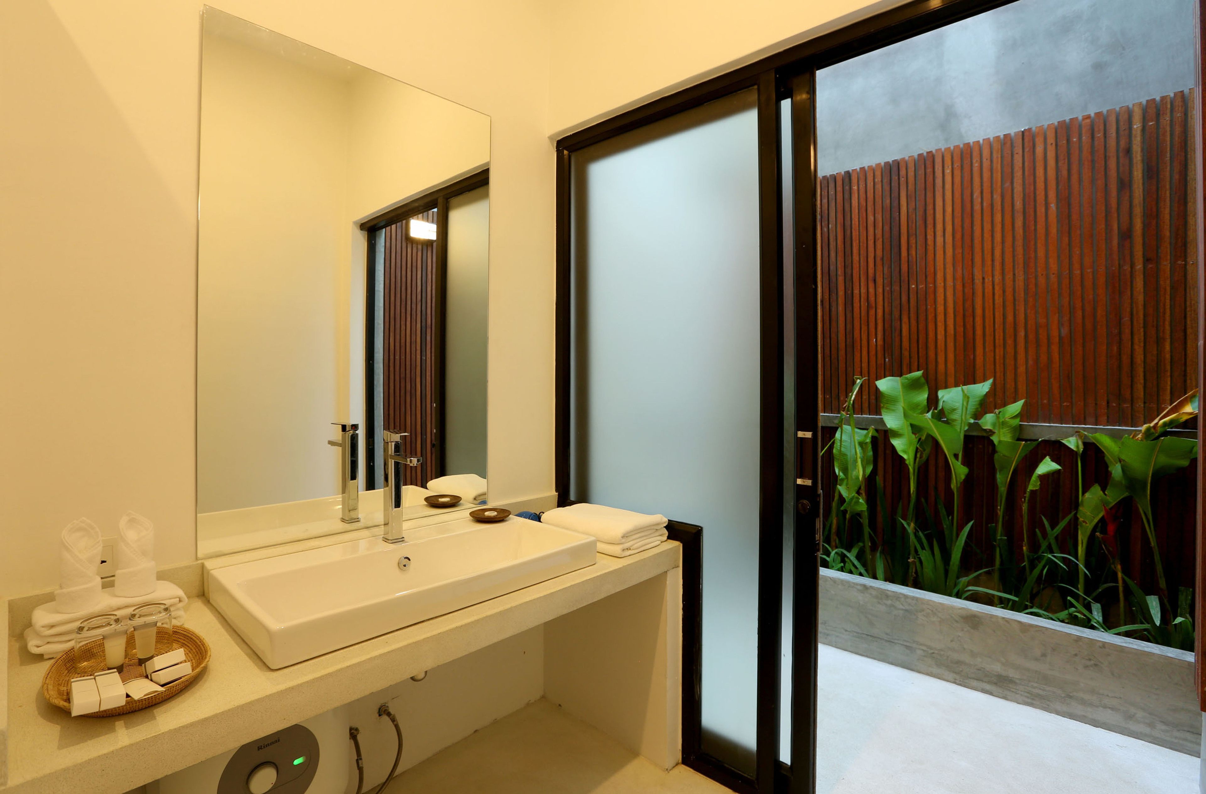 deluxe double room with pool view | bathroom | shower, free toiletries, hair dryer, bathrobes