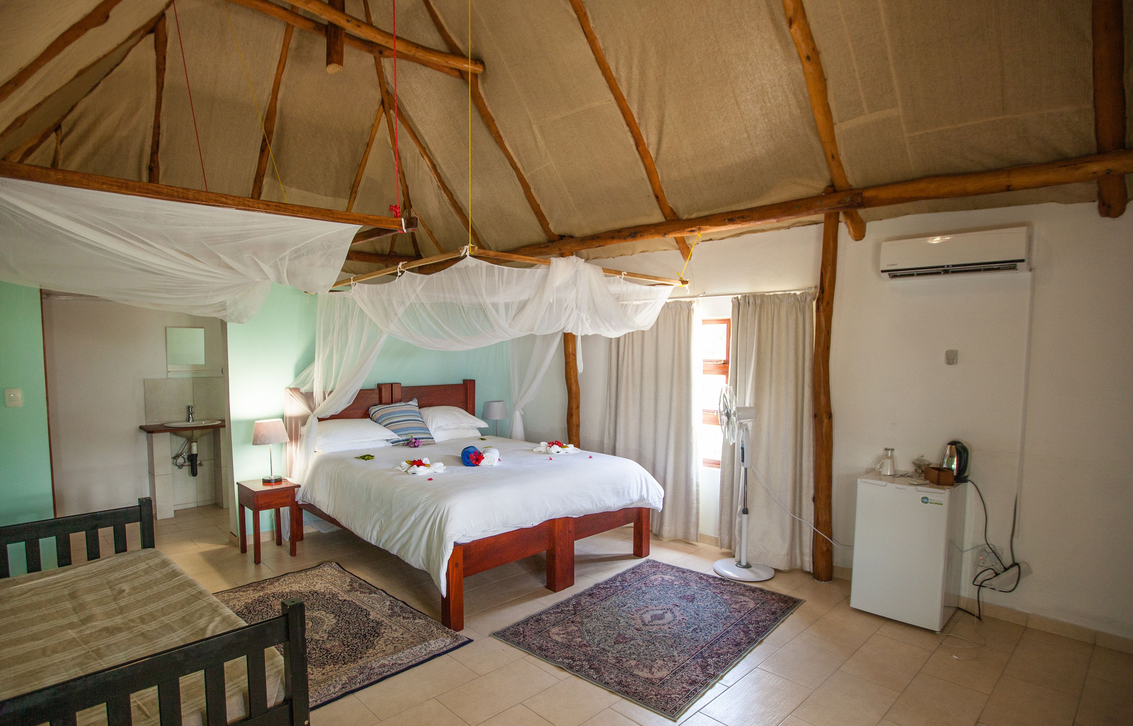 family quadruple room, beachfront | living room