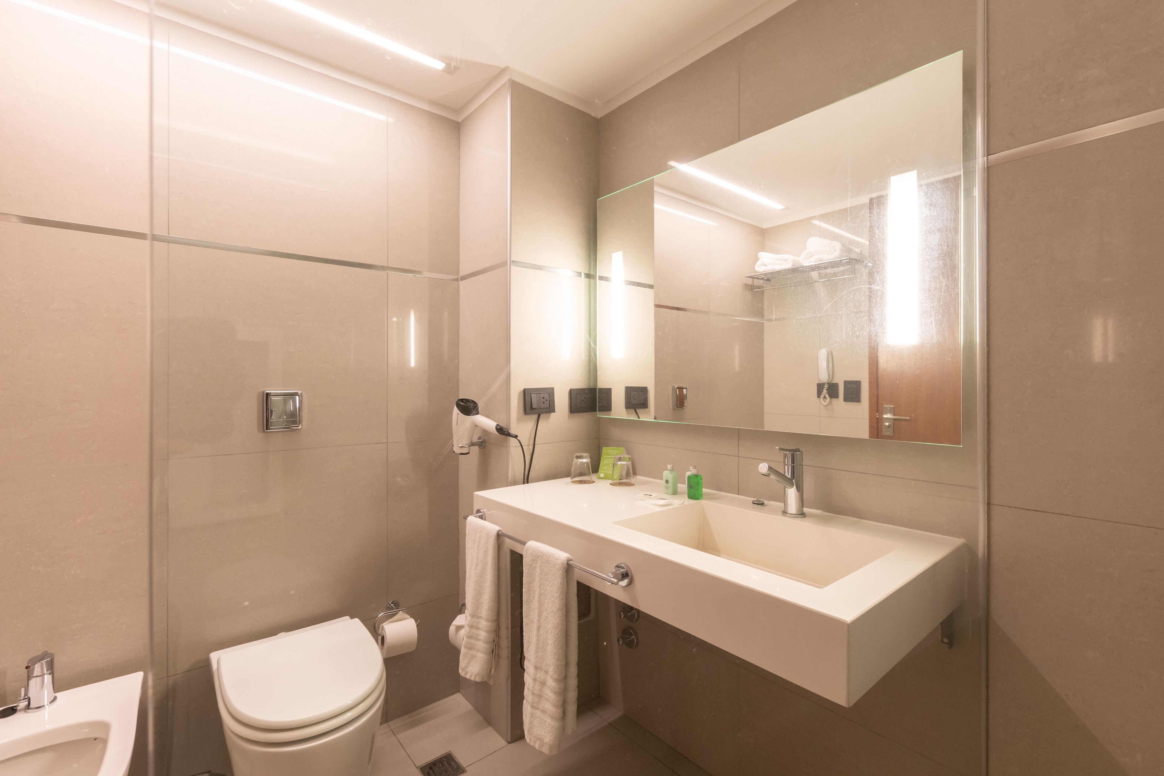 shower, free toiletries, hair dryer, towels