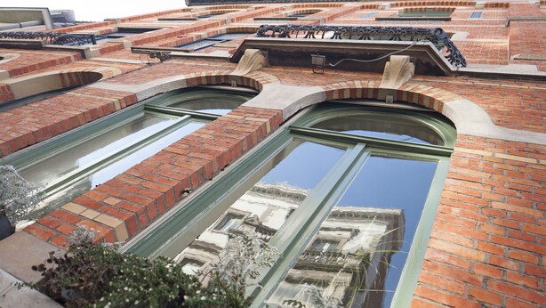 A building with arched windows and brickwork.