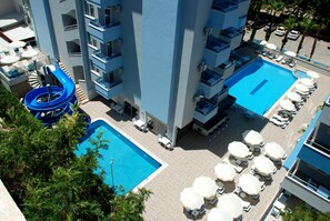 2 outdoor pools, pool umbrellas, pool loungers