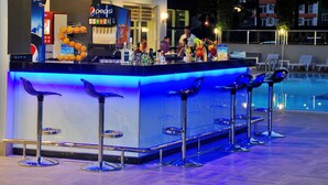 A bar area with a Pepsi sign, bar stools, and a poolside setting. - Kleopatra Ramira Hotel - All Inclusive (Alanya)