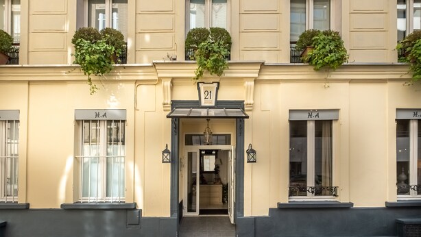A building facade with multiple windows labeled "H.A." and a number "21" above the entrance. - Hotel de l'Avre (Paris)