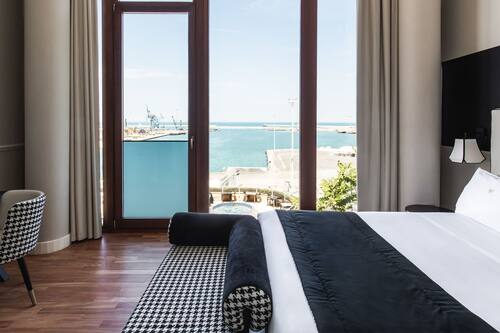 Chambre Deluxe, 1 grand lit, vue mer | Draps en coton égyptien, literie de qualité supérieure
