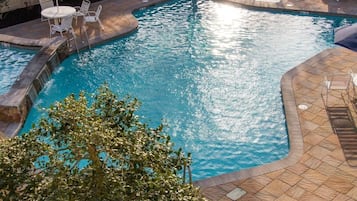 Seasonal outdoor pool, pool umbrellas, pool loungers
