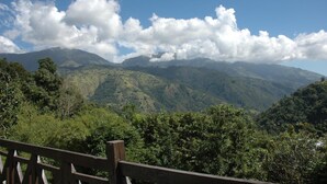 A mountainous landscape with a wooden fence in the foreground. - Forres Park Resort & Spa (Mavis Bank)