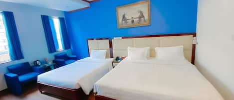Family Room | Minibar, in-room safe, blackout drapes, iron/ironing board