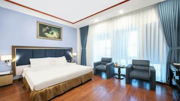 Deluxe Suite Double | Minibar, in-room safe, blackout curtains, iron/ironing board