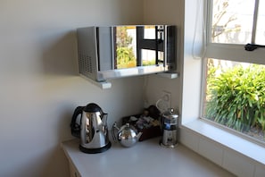 Fridge, microwave, stovetop, coffee/tea maker