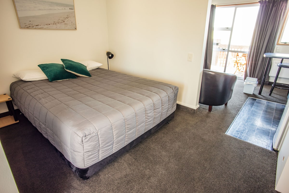 Twin Studio | Individually decorated, individually furnished, blackout drapes