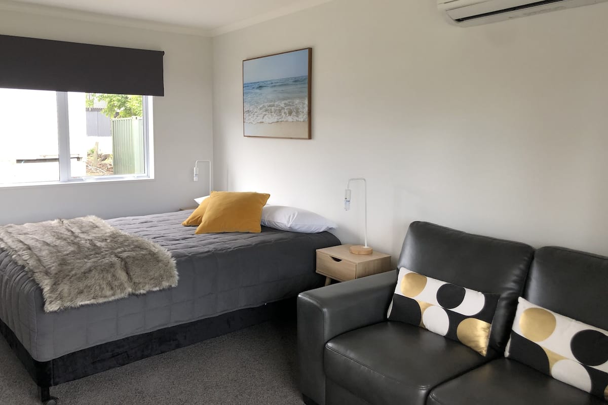 Queen Studio Unit 6 | Individually decorated, individually furnished, blackout drapes