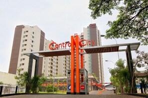 A modern building with a sign that reads "CentroCity". - Centro City Service Apartment (Jakarta)